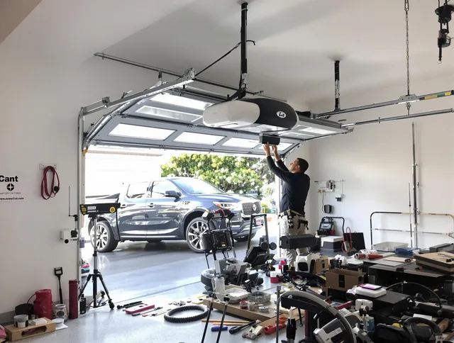 Medway Garage Door Repair specialist installing smart garage door opener system in Medway home
