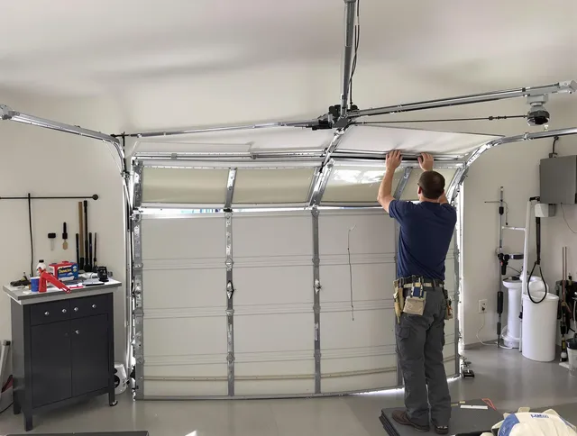 Medway Garage Door Repair specialist performing precise section replacement on Medway garage door